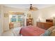 Bright bedroom featuring a ceiling fan and ample closet space at 580 Teesdale, Haines City, FL 33844