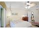 Comfortable bedroom with a ceiling fan and serene decor at 580 Teesdale, Haines City, FL 33844