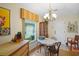 Charming dining room with a vintage table and window views at 580 Teesdale, Haines City, FL 33844