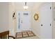 Bright entryway with white door and decorative mirror at 580 Teesdale, Haines City, FL 33844