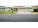 Single-story home with attached garage and landscaped yard at 580 Teesdale, Haines City, FL 33844