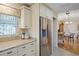 Kitchen boasts granite counters, stainless steel appliances, and view to dining area at 580 Teesdale, Haines City, FL 33844
