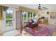 Relaxing sunroom with pond views and comfortable seating at 580 Teesdale, Haines City, FL 33844