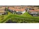 Community overview featuring multiple homes and a pond at 6052 Broad Oak Dr, Davenport, FL 33837