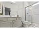 Clean bathroom with a walk-in shower and a vanity with a large mirror at 6052 Broad Oak Dr, Davenport, FL 33837