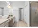 Double vanity bathroom with a walk-in shower and tile flooring at 6052 Broad Oak Dr, Davenport, FL 33837