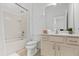 Clean bathroom with tub, toilet and updated vanity at 6052 Broad Oak Dr, Davenport, FL 33837