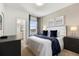Main bedroom with a king-size bed and ensuite bathroom access at 6052 Broad Oak Dr, Davenport, FL 33837