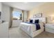 Spacious bedroom with a king-size bed and large window at 6052 Broad Oak Dr, Davenport, FL 33837