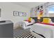 bedroom with twin beds and fun decor at 6052 Broad Oak Dr, Davenport, FL 33837