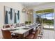 Bright dining room with seating for eight and pool view at 6052 Broad Oak Dr, Davenport, FL 33837