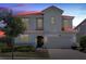 Two-story house with a red tile roof, large garage, and landscaping at 6052 Broad Oak Dr, Davenport, FL 33837