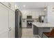 Modern kitchen with stainless steel appliances and island at 6052 Broad Oak Dr, Davenport, FL 33837