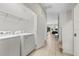 Laundry room with washer, dryer, and shelving at 6052 Broad Oak Dr, Davenport, FL 33837