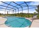 Inviting screened pool and spa with lounge chairs at 6052 Broad Oak Dr, Davenport, FL 33837