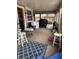 Enclosed back patio with ample space for relaxation and grilling at 704 N 8Th St, Haines City, FL 33844