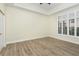 Spacious bedroom with wood-look flooring and large windows at 706 Westpark Way # 103, Celebration, FL 34747