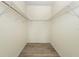 Large walk-in closet with wire shelving at 706 Westpark Way # 103, Kissimmee, FL 34747