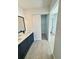 Updated bathroom with double vanity and walk-in closet at 7450 Crooked Lake Cir, Orlando, FL 32818