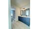 Modern bathroom with double vanity and dark cabinets at 7450 Crooked Lake Cir, Orlando, FL 32818