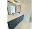 Modern bathroom with double vanity and dark cabinets at 7450 Crooked Lake Cir, Orlando, FL 32818