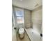 Modern bathroom featuring a walk-in shower and toilet at 7450 Crooked Lake Cir, Orlando, FL 32818