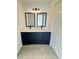 Bathroom with double vanity and modern light fixtures at 7450 Crooked Lake Cir, Orlando, FL 32818