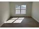 Bright bedroom with large window and wood-look floors at 7450 Crooked Lake Cir, Orlando, FL 32818