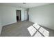 Spacious bedroom with wood-look flooring and an ensuite bathroom at 7450 Crooked Lake Cir, Orlando, FL 32818