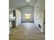 Bright dining room with large window and hardwood floors at 7450 Crooked Lake Cir, Orlando, FL 32818