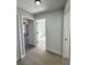 Bright hallway with light walls and wood-look flooring at 7450 Crooked Lake Cir, Orlando, FL 32818