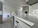 Modern kitchen boasts a spacious island with quartz countertops and sleek cabinetry at 7450 Crooked Lake Cir, Orlando, FL 32818