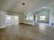 Open living room with high ceilings and modern flooring at 7450 Crooked Lake Cir, Orlando, FL 32818