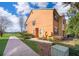 Exterior of townhome with manicured landscaping and well maintained sidewalk at 7588 Assembly Ln, Reunion, FL 34747