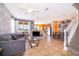 Open-concept living and dining area with tile flooring and ample natural light at 7588 Assembly Ln, Reunion, FL 34747