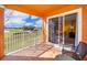 Relaxing patio overlooking a lush green golf course, perfect for enjoying the outdoors in comfort at 7588 Assembly Ln, Reunion, FL 34747