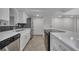 Modern kitchen with white cabinets, stainless steel appliances, and quartz countertops at 776 E Michigan St # 63, Orlando, FL 32806