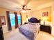 Large Primary bedroom with a king-size bed and plenty of natural light at 909 Charo Pkwy # 1035, Davenport, FL 33897