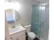 Updated bathroom with a walk-in shower, white vanity, and modern fixtures at 1972 S Old Mill Dr, Deltona, FL 32725