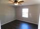 Bedroom with dark laminate floors and ceiling fan at 1972 S Old Mill Dr, Deltona, FL 32725