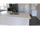 Modern kitchen with white cabinets, quartz countertops, and stainless steel appliances at 1972 S Old Mill Dr, Deltona, FL 32725