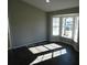 Spacious living room with bay window, dark laminate floors, and recessed lighting at 1972 S Old Mill Dr, Deltona, FL 32725