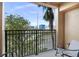 Private balcony with seating, overlooking a residential area at 12538 Floridays Resort Dr # 411, Orlando, FL 32821