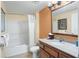Clean bathroom with granite vanity, tub/shower combo and updated fixtures at 12538 Floridays Resort Dr # 411, Orlando, FL 32821
