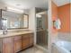 Relaxing bathroom with a soaking tub and walk-in shower at 12538 Floridays Resort Dr # 411, Orlando, FL 32821