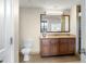 Bathroom with a large vanity, toilet and shower at 12538 Floridays Resort Dr # 411, Orlando, FL 32821