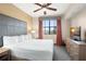 King-size bed in the main bedroom with TV and balcony view at 12538 Floridays Resort Dr # 411, Orlando, FL 32821