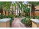Landscaped courtyard entrance to the building at 12538 Floridays Resort Dr # 411, Orlando, FL 32821