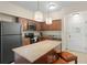 Modern kitchen with granite countertops, stainless steel appliances, and an island at 12538 Floridays Resort Dr # 411, Orlando, FL 32821