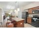 Modern kitchen with stainless steel appliances and an island at 12538 Floridays Resort Dr # 411, Orlando, FL 32821